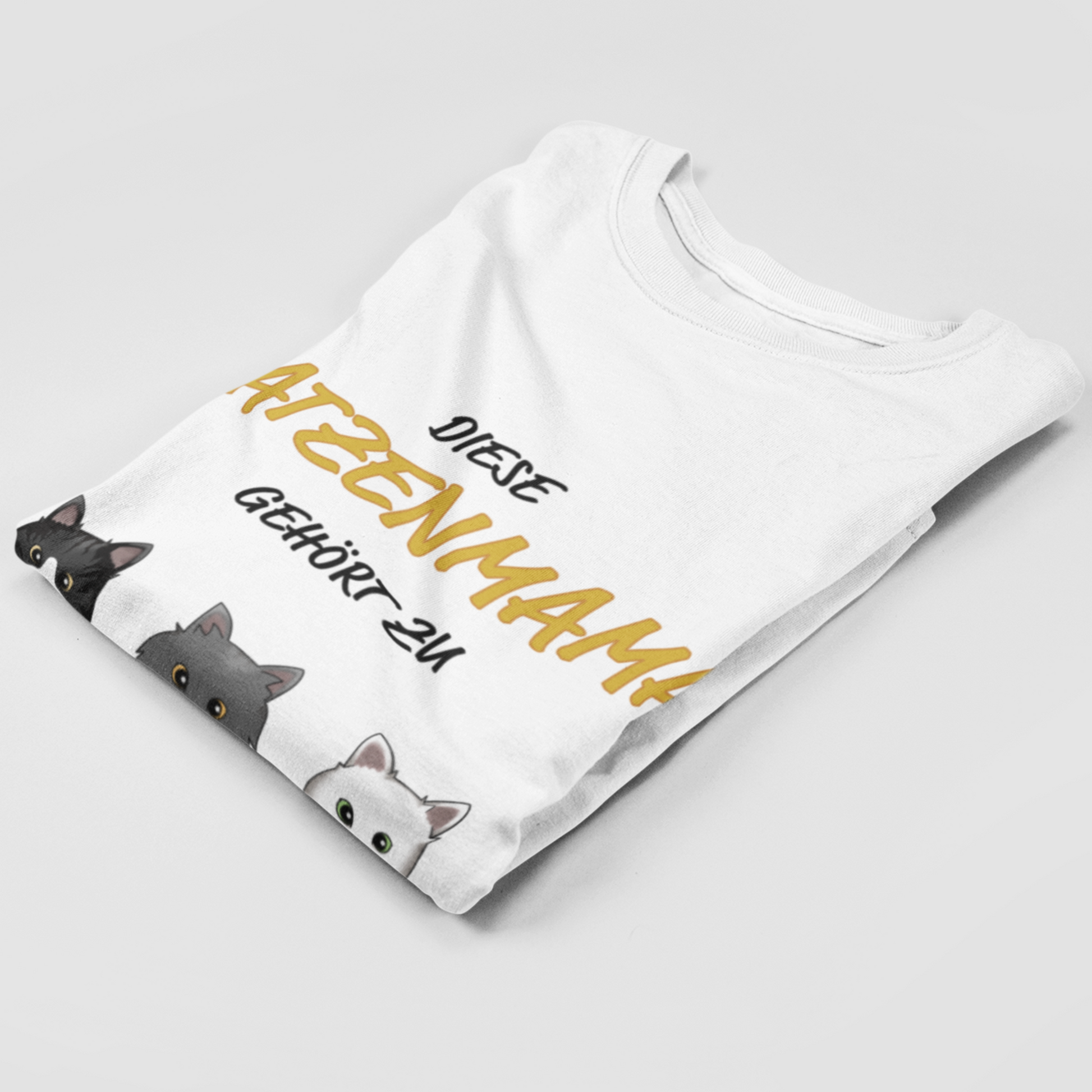 Folded Personalized Katzenmama T-Shirt showcasing unique cat motif print.