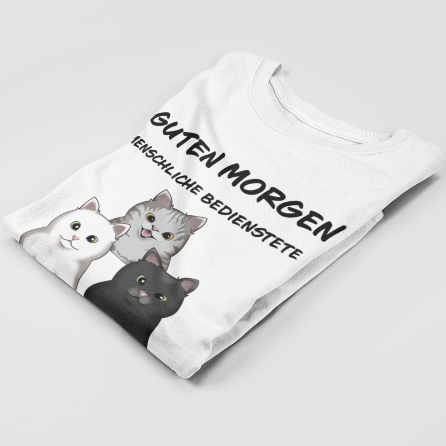 Folded Personalized Menschliche Bedienstete T-Shirt showcasing unique cat motif print.