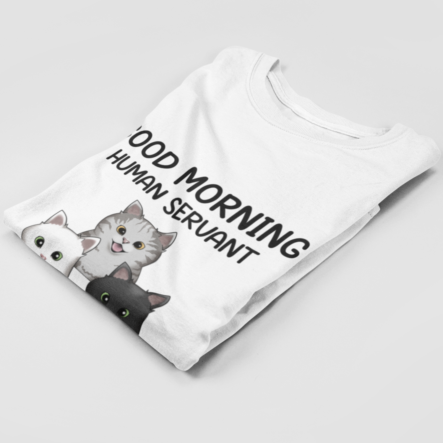 Folded Personalized Human Servant T-Shirt showcasing unique cat motif print.