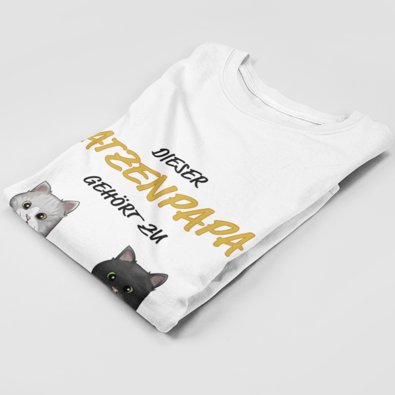Folded Personalized Katzenpapa T-Shirt showcasing unique cat motif print.